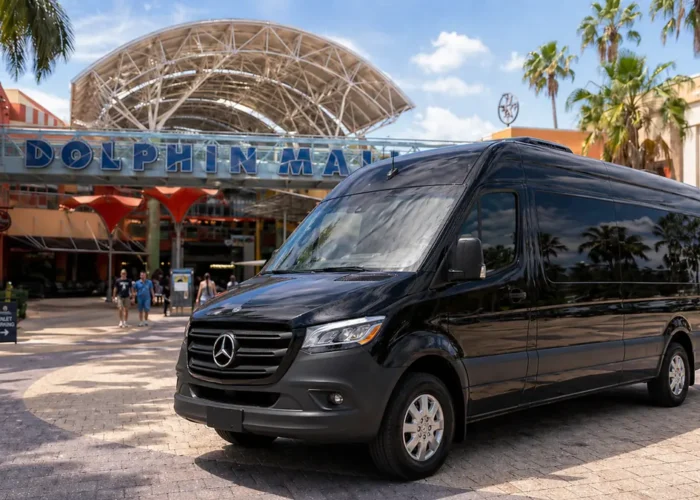 Black Mercedes Sprinter van at the entrance of Dolphin Mall in Miami for a private shopping transfer